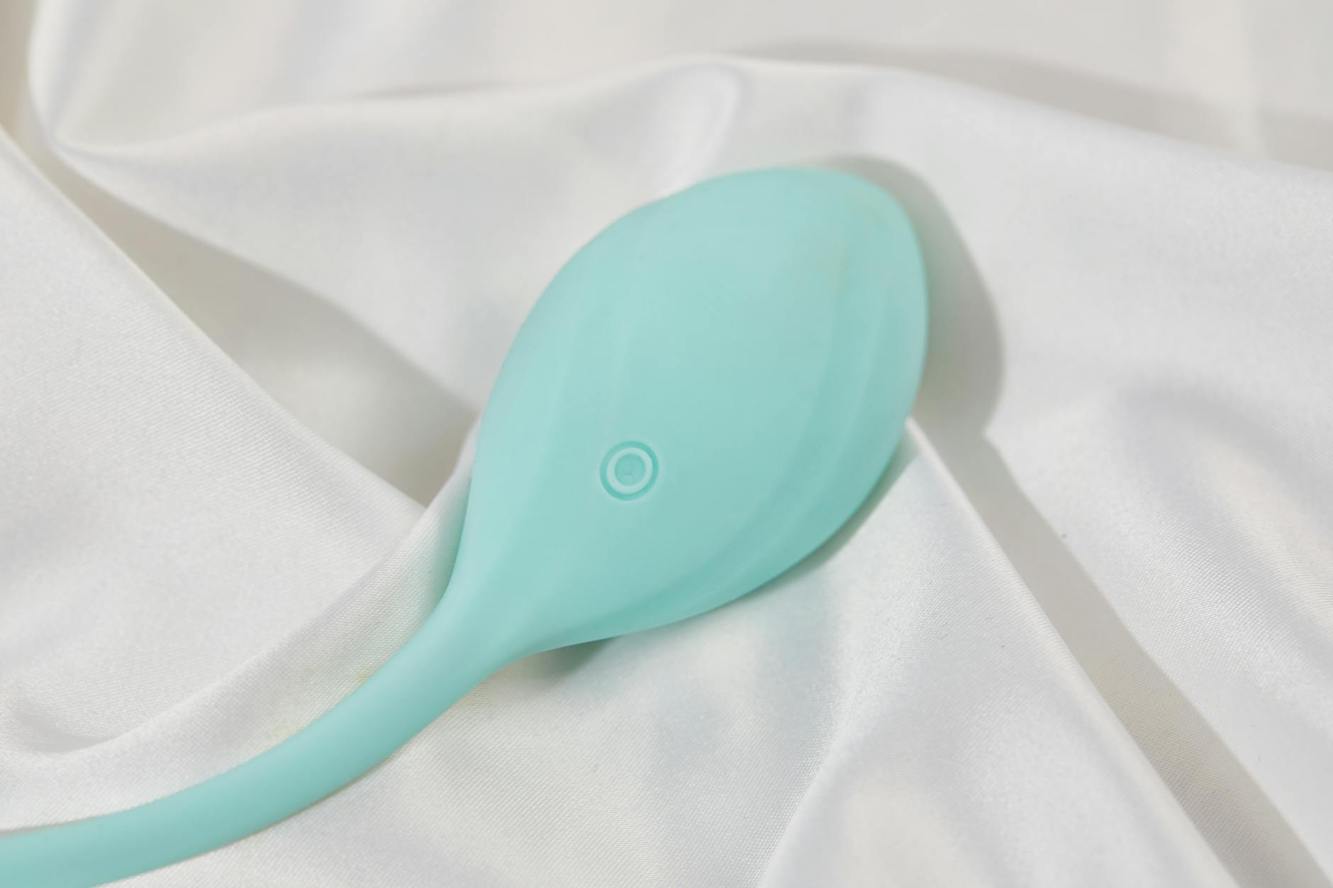 A couple standing together holding a blue vibrator, symbolizing modern intimacy during life transitions.
